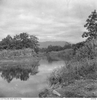 BUTIBUM RIVER, LAE AREA, NEW GUINEA. 1943-11. THE RIVER AT A POINT NEAR KAMKAMUN. THE 10TH FIELD AMBULANCE, AUSTRALIAN ARMY MEDICAL CORPS IS LOCATED IN THE AREA