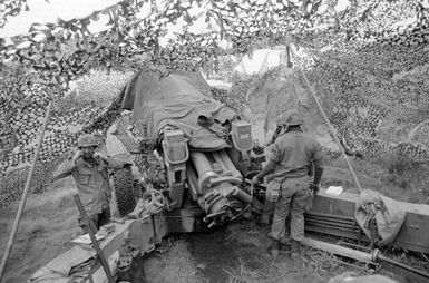 A fire team from the 1ST Battalion, 8th Field Artillery Regiment, prepares to fire their M198 155 mm Howitzer during Exercise OPPORTUNE JOURNEY 2-86