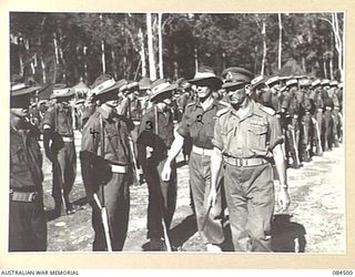 BOUGAINVILLE, SOLOMON ISLANDS, 1944-12-21. MAJOR-GENERAL W. BRIDGEFORD, GENERAL OFFICER COMMANDING 3 DIVISION, (1), WITH LIEUTENANT-COLONEL J.H. BYRNE, COMMANDING OFFICER (2), INSPECTING ..