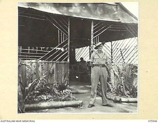 ORO BAY, NEW GUINEA. 1943-07. CORPORAL KIRLEY OUTSIDE THE RECREATION HUT OF THE 10TH FIELD AMBULANCE