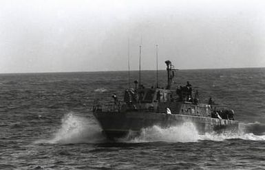 A port bow view of a Mk III series patrol boat underway near Naval Station, Guam