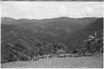 Tsembaga dance ground and fence, Bismarck Range mountains with garden clearings in background