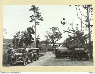 WAU, NEW GUINEA. 1944-04-26. STAFF CARS AND JEEPS USED TO TRANSPORT THE HONOURABLE E.J. WARD, MINISTER FOR EXTERNAL TERRITORIES IN THE AUSTRALIAN GOVERNMENT AND MEMBERS OF HIS OFFICIAL PARTY, ..