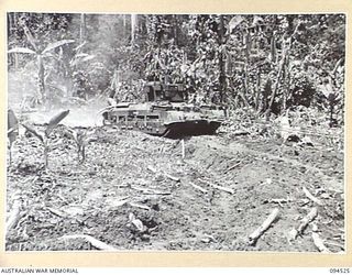 TOROKINA, BOUGAINVILLE, 1945-08-02. A MATILDA TANK BEING PULLED FROM A BOG BY M24 GENERAL CHAFFEE LIGHT TANKS. THE MATILDA BECAME BOGGED DURING TRIALS OF THE M24 CONDUCTED FOR THE WAR OFFICE