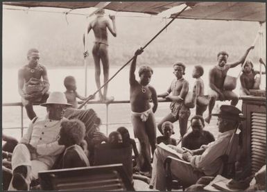 Bishop Wilson and Captain Sinker with Vella Lavella people on the Southern Cross, Solomon Islands, 1906 / J.W. Beattie