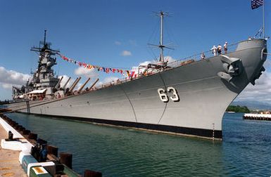 The battleship USS MISSOURI (BB-63) stands moored to a pier during an observance commemorating the 50th anniversary of the Japanese attack on Pearl Harbor