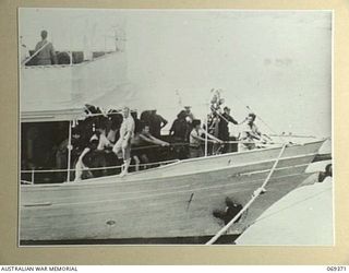 PORT MORESBY, NEW GUINEA. 1942-04-12. HMAS "LAURABADA" WITH SERVICE PERSONNEL AND CIVILIANS WHO HAS TAKEN TO THE JUNGLE OF NEW BRITAIN AFTER THE WITHDRAWAL OF THE HOPELESSLY OUTNUMBERED RABAUL ..