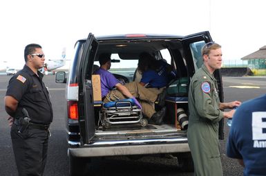 Earthquake ^ Tsunami - Pago Pago, American Samoa, October 5, 2009 -- Members of a Disaster Medical Assistance Team (DMAT)prepare to transfer an infant to a Coast Guard plane that will evacuate the infant to Hawaii. DMATs are part of the U. S. Department of Health and Human Services' National Disaster Medical System which supports hospitals and other medical and public health needs of communities during disasters such as the earthquake and tsunami disaster in American Samoa. FEMA/Casey Deshong