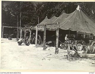 PERSONNEL OF THE JEEP AND CYCLE REPAIR SECTION AT WORK IN THE LINES OF THE 109TH BRIGADE WORKSHOPS