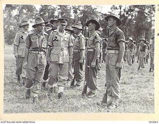 LAE AREA, NEW GUINEA, 1945-06-16. LT-GEN V.A.H. STURDEE, GOC FIRST ARMY (2) AND MAJ F.L. HICKS, COMMANDING OFFICER 8 FIELD COMPANY (1), INSPECTING TROOPS OF THE UNIT DURING A PARADE ATTENDED BY ALL ..