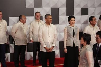 Barack Obama joins Asia Pacific Economic Cooperation Summit leaders and spouses for a group photo in Pasay, Metro Manila, Philippines, November 18, 2015