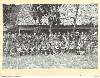 PORT MORESBY, NEW GUINEA. 1944-05-01. HEADQUARTERS STAFF, DEPUTY DIRECTOR OF ORDNANCE STORES, OUTSIDE THEIR OFFICE IN THE CAMP STAFF AREA, HEADQUARTERS NEW GUINEA FORCE