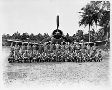 A Group Photo of Marine Fighter Squadron 214 in Front of an F4U Corsair Aircraft