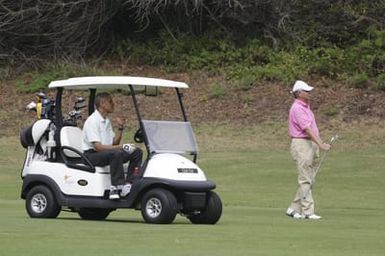 Barack Obama plays golf with Prime Minister Najib Razak, Joe Paulsen, and Mike Brush in Kaneohe Bay, Hawaii, December 24, 2014