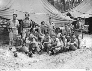 MOMOTE, LOS NEGROS ISLAND, ADMIRALTY ISLANDS. C. 1944-04. GROUP PORTRAIT OF PILOTS OF NO. 79 (SPITFIRE) SQUADRON RAAF, OUTSIDE THEIR ALERT HUT. SHOWN: BACK ROW: FLIGHT LIEUTENANT MAX BRINSLEY DFC, ..