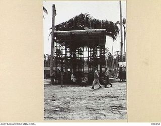 MUSCHU ISLAND, NEW GUINEA. 1945-10-27. A TOWER ERECTED BY THE JAPANESE, USING AUSTRALIAN EQUIPMENT, BESIDE THE HOSPITAL TO SUPPLY THE WARDS WITH WATER. THERE ARE EIGHT TANKS ON THE TOWER EACH ..