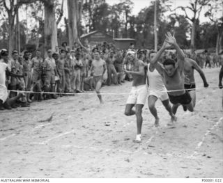 THE SOLOMON ISLANDS, 1945-01-12. DESPERATE FINISH TO A SPRINT RACE AT A COMBINED ANZAC SPORTS MEETING AT BOUGAINVILLE ISLAND. (RNZAF OFFICIAL PHOTOGRAPH.)