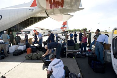 Earthquake ^ Tsunami - Barbers Point, Hawaii, September 30, 2009 -- Responders from FEMA and other federal agencies prepare to board a U. S. Coast Guard plane heading for American Samoa. FEMA is the lead federal agency in the response to the earthquake and tsunami disaster. FEMA/Casey Deshong