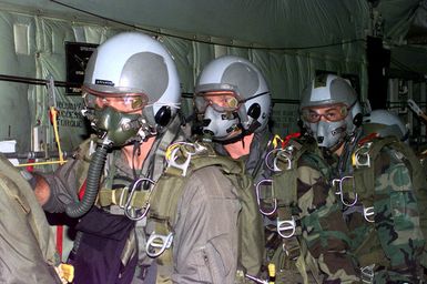 Internal shot inside the cargo bay of a USAF C-130 Hercules cargo plane at US Marines, 2nd Platoon, Company A, 5th Force Reconnaissance Battalion, 3rd Marine Division, as they wait patiently for the rear hatch (Not shown) on the C-130 to open. They will jump static line with MC5 square parachute during the Force Reconnaissance Exercises at Andersen Air Force Base, Guam