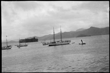 Boats moored in harbour with a tree covered island in background, New Guinea, ca. 1929 / Sarah Chinnery