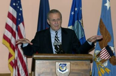 U.S. Secretary of Defense The Honorable Donald H. Rumsfeld, speaks to troops at the Magellan Inn Dining facility during his visit to Andersen Air Force Base, Guam, Nov. 14, 2003. Troops from all military services were in attendance for the speech. (DoD photo by SENIOR AIRMAN Joshua Strang) (Released)