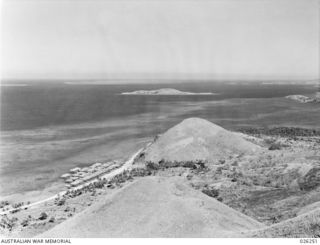 PORT MORESBY, PAPUA. 1942-08. LOOKING OVER PARI VILLAGE FROM MAATA POST "C" IN THE DIRECTION OF THE REEF OPENING THROUGH WHICH SHIPPING PASSES
