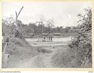 MIVO RIVER, BOUGAINVILLE, 1945-08-29. AFTER JAPANESE ENVOYS HAD OPENED SURRENDER NEGOTIATIONS ON 1945-08-18, AN AUSTRALIAN CAMP, UNDER MAJOR K.V.L. KESTEVEN, 15 INFANTRY BATTALION, AND A JAPANESE ..