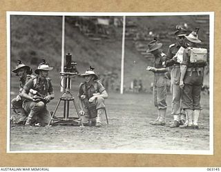 DONADABU, PAPUA, NEW GUINEA. 1944-01-01. JUDGES OF THE COMPETITION AND MEMBERS OF THE WINNING MORTAR TEAM AT THE 15TH INFANTRY BRIGADE GYMKHANA. IDENTIFIED PERSONNEL ARE: VX144708 PRIVATE H. F. ..