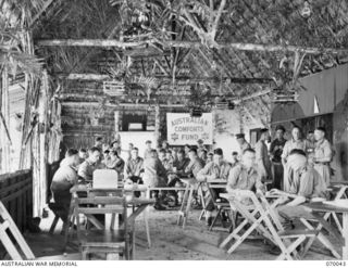 PORT MORESBY, NEW GUINEA. 1944-01-22. THE INTERIOR OF THE RECREATION HUT CONSTRUCTED BY THE 2/101ST GENERAL TRANSPORT COMPANY ON THEIR CAMP SITE AND EQUIPPED BY THE AUSTRALIAN COMFORTS FUND. ..