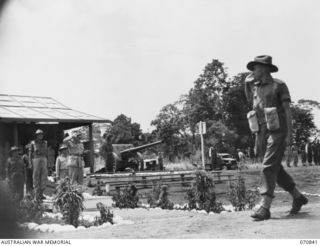 LAE, NEW GUINEA, 1944-03-08. V20308 MAJOR-GENERAL F.H. BERRYMAN, CBE, DSO (1), GENERAL OFFICER COMMANDING 2ND AUSTRALIAN CORPS, TAKES THE SALUTE FROM QX36064 CAPTAIN R.J. DONALD (5), HEADQUARTERS ..