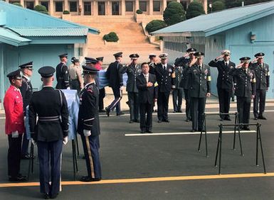 A delegation of United Nations Command Military Armistice Commission (UNCMAC) officials pay their respects to what is believed to be one of five U.S. soldiers killed in the Korean War who were repatriated during a ceremony at the Panmunjom Freedom House. The delegation received the remains from North Korean officials during the eighth repatriation ceremony held since joint search and recovery operations began in Korea in 1996. The five sets of remains brings the total returned to 19. Kim Yong-kyu, a spokesman for the U.N. command said the remains were recovered from Gaechon City, about 50 miles north of Pyongyang. The U.S. 2nd Infantry Division suffered nearly 5,000 casualties while...
