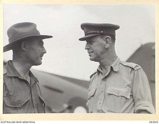 AITAPE, NEW GUINEA. 1944-11-29. MAJOR- GENERAL R H WORDSWORTH, BRITISH ARMY, (2), WITH LIEUTENANT- COLONEL J A BISHOP, GENERAL STAFF OFFICER I HQ 6 DIVISION, (1), ON ARRIVAL AT TADJI AIRSTRIP BY ..