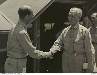 New Guinea. 1944-10-17. Colonel Diller, US Army, greeting President Sergio Osmena, President of the Philippines, at an Allied base