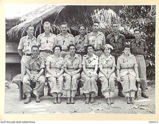 Lae area, New Guinea, 1945-08-23. Unidentified members of Allied Translator and Interpreter Section, Australian Army Air Photo Interpretation Unit and Army Field Security Group, Intelligence Corps, ..