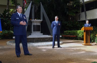 U.S. Air Force Commander Pacific Air Forces GEN. Paul V. Hester (left), speaks before presenting the Legion of Merit Medal to Director of Plans and Programs Brig. GEN. Glenn F. Spears (center), at Hickam Air Force Base, Hawaii, on Jan. 27, 2005.(U.S. Air Force PHOTO by Mr. Eddie Foster) (Released)