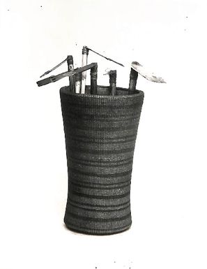 Photo of adzes in a container