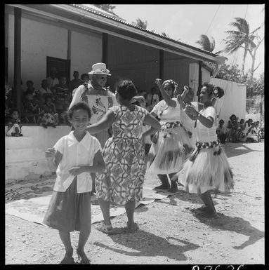 New Zealand's Minister for Internal Affairs, Island Territories, Mr Gotz, dancing with people of Tauhunu village, Manihiki Island, Cook Islands - Photograph taken by R Fox