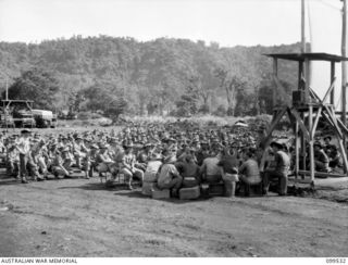 RABAUL, NEW BRITAIN, 1945-12-21. CAPTAIN J. J. PRATT, 1 PSYCHOLOGY UNIT, LECTURING ON REHABILITATION TO MEMBERS OF HEADQUARTERS 11 DIVISION SOON TO EMBARK FOR THE MAINLAND