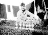 Ralph Gaugler with liquor bottles on New Caledonia, 1942