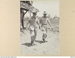 AITAPE, NEW GUINEA. 1944-11-22. LIEUTENANT- GENERAL STURDEE, COMMANDER FIRST ARMY, (1), WITH LIEUTENANT- COLONEL G S NOAD, SECOND- IN- CHARGE, 2/11 GENERAL HOSPITAL, (2), LEAVE THE HOSPITAL'S ..