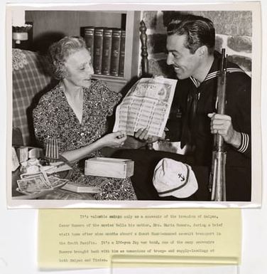 Cesar Romero with his mother, Mrs. Maria Romero, during a brief visit home after nine months aboard a Coast Guard-manned assault transport in the South Pacific