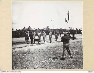 CAPE WOM, NEW GUINEA, 1945-09-13. LIEUTENANT-GENERAL H. ADACHI, COMMANDER 18 JAPANESE ARMY IN NEW GUINEA STANDING FACING MAJOR-GENERAL H.C.H. ROBERTSON, GENERAL OFFICER COMMANDING 6 DIVISION, WITH ..