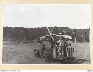 RABAUL, NEW BRITAIN. 1945-10-27. A JAPANESE ROLLER, MANNED BY FORMER JAPANESE TROOPS, PREPARING THE DIVISIONAL PARADE GROUND IN WHAT WAS ONCE THE MAIN PART OF RABAUL. THE PREPARATIONS ARE FOR THE ..