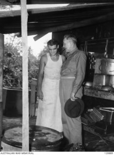 RABAUL, NEW BRITAIN. 1945-12-28. THE PRIME MINISTER OF AUSTRALIA, MR BEN CHIFLEY, ARRIVED BY PLANE TO VISIT MANY OF THE UNITS IN THE AREA. THE PRIME MINISTER, VISITING THE 11TH BATTALION'S ..