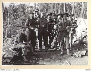 WEWAK AREA, NEW GUINEA. 1945-06-27. MORTAR CREW OF C COMPANY, 2/8 INFANTRY BATTALION READY TO MOVE DOWN TO THE COAST FOR A WELL EARNED SPELL AFTER THE CAPTURE OF MOUNT SHIBURANGU. IDENTIFIED ..