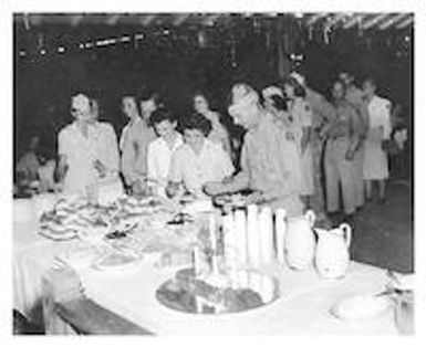 Servicemen and women in line at a buffet