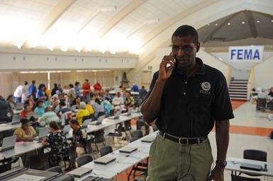 Earthquake ^ Tsunami - Utulei, American Samoa, October 9, 2009 -- Federal Coordinating Officer Kenneth Tingman takes a call on recovery operations. Tingman was visiting FEMAs Disaster Recovery Center on the second day of operations while the center serviced the survivors from Pago Pago village. Dan Stoneking/FEMA