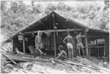 People working on house, Kwailala'e