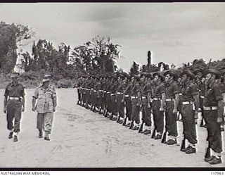 TOROKINA, BOUGAINVILLE. 1945-10-29. GENERAL SIR THOMAS A. BLAMEY, COMMANDER IN CHIEF, AUSTRALIAN MILITARY FORCES, INSPECTING MEMBERS OF 3RD DIVISION, GUARD OF HONOUR, ON THE PIVA AIRSTRIP