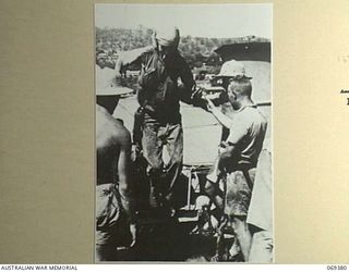 PORT MORESBY, NEW GUINEA. 1942-04-12. ONE OF THE EVACUEES FROM NEW BRITAIN LEAVING THE HMAS "LAURABADA". HE AND OTHER EVACUEES TOOK TO THE JUNGLE FOLLOWING THE SUCCESSFUL JAPANESE LANDING AT RABAUL ..